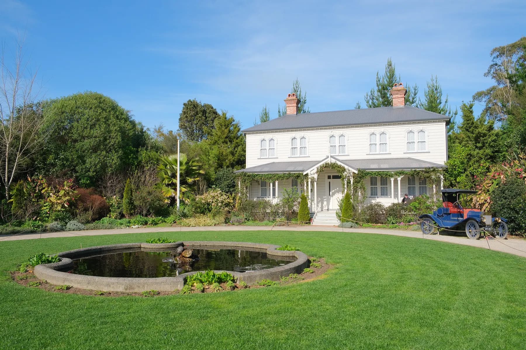 Wide green lawn beside a landscaped garden bed